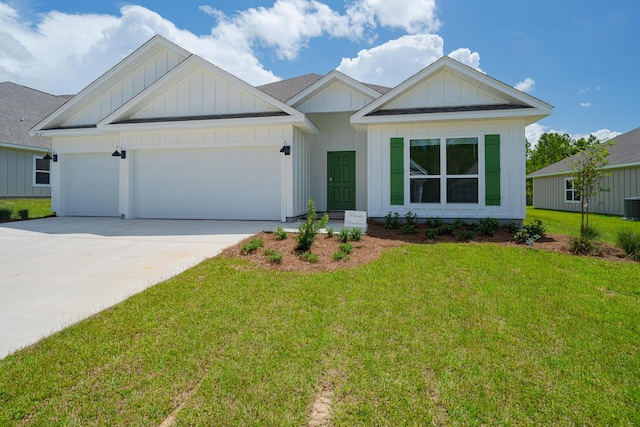 view of front facade with a front yard, a garage, and central air condition unit