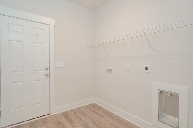 clothes washing area featuring hookup for an electric dryer, light wood-type flooring, and hookup for a washing machine