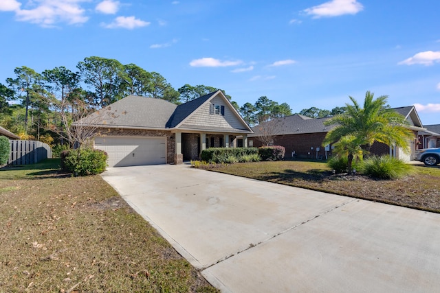 view of front of property featuring a garage and a front lawn