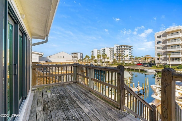 wooden terrace with a water view