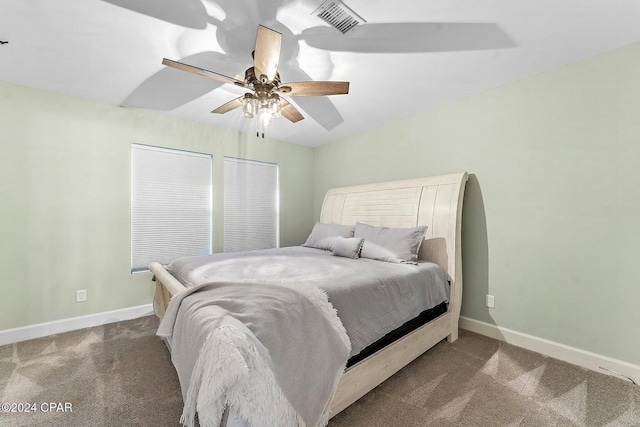 bedroom featuring dark colored carpet and ceiling fan