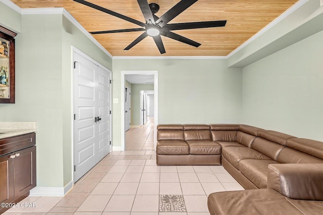 unfurnished living room with ceiling fan, light tile patterned flooring, wooden ceiling, and ornamental molding