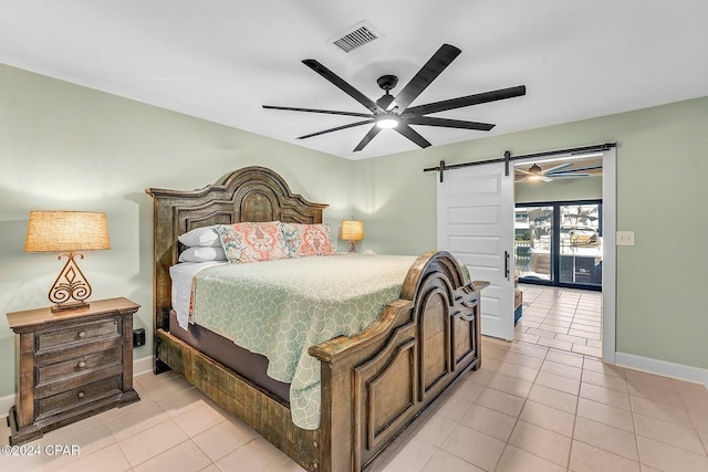 bedroom with access to outside, a barn door, ceiling fan, and light tile patterned floors