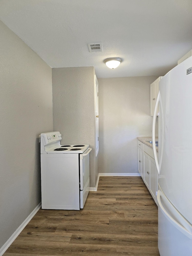 laundry room featuring dark hardwood / wood-style flooring