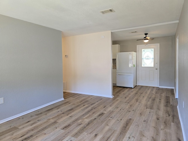 entryway with ceiling fan and light hardwood / wood-style floors