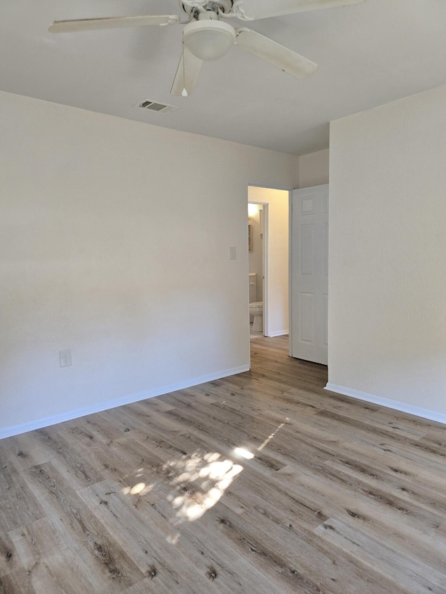 empty room with light hardwood / wood-style floors