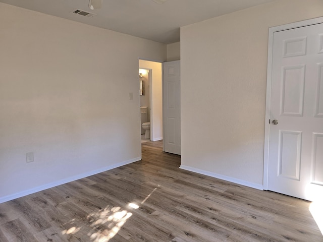 spare room featuring light wood-type flooring