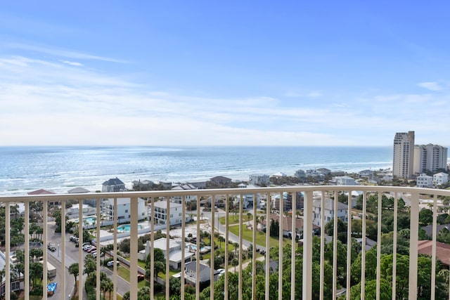 balcony with a beach view and a water view