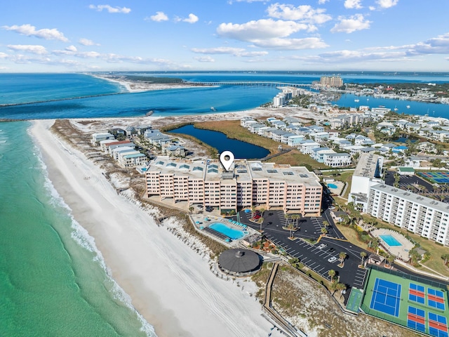 drone / aerial view with a water view and a view of the beach