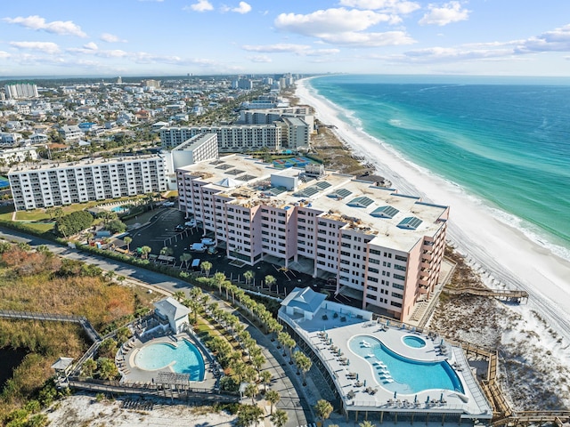 drone / aerial view with a water view and a view of the beach