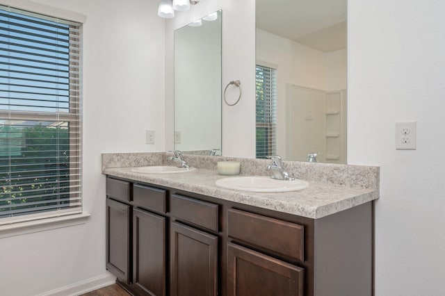 bathroom featuring vanity and walk in shower