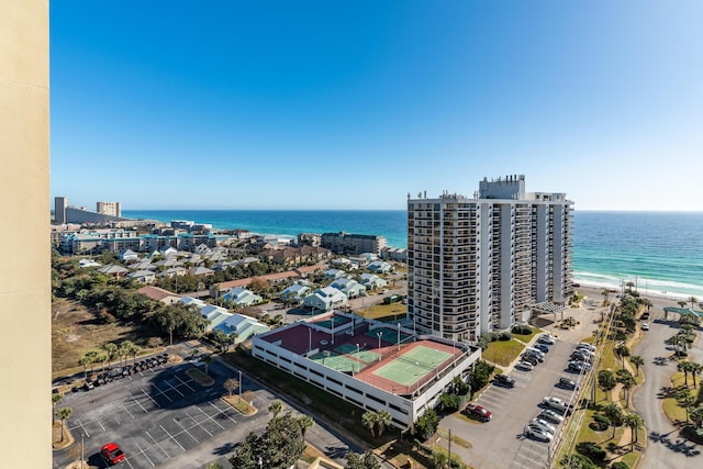 birds eye view of property with a water view and a view of the beach