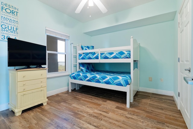 bedroom with ceiling fan and wood-type flooring