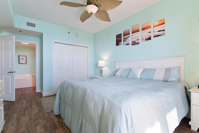 bedroom featuring ceiling fan, dark hardwood / wood-style flooring, and a closet