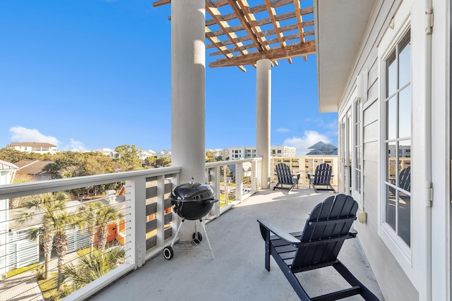 balcony with a pergola and grilling area