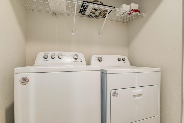 washroom with separate washer and dryer