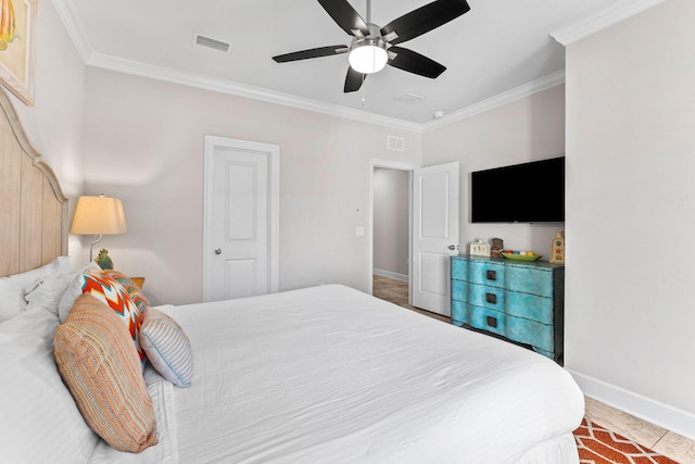 tiled bedroom with ceiling fan and ornamental molding