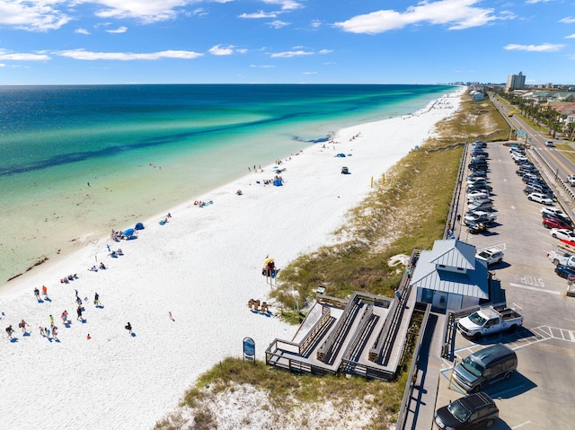 birds eye view of property featuring a water view and a view of the beach