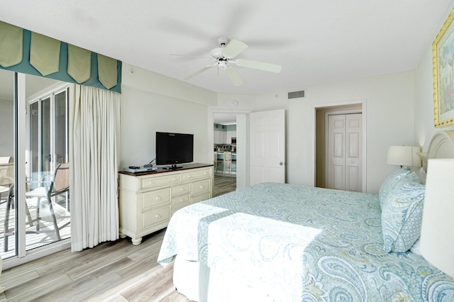 bedroom with ceiling fan, light hardwood / wood-style flooring, access to outside, and a closet