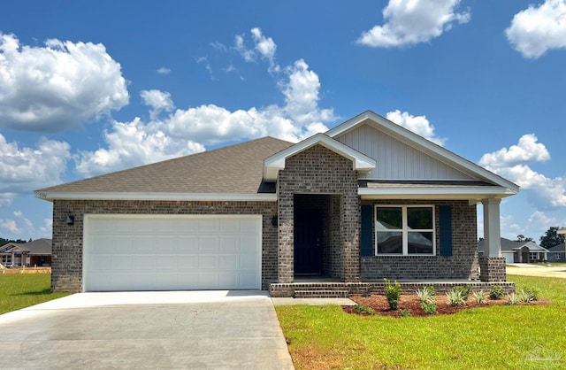 view of front of property featuring a garage and a front lawn