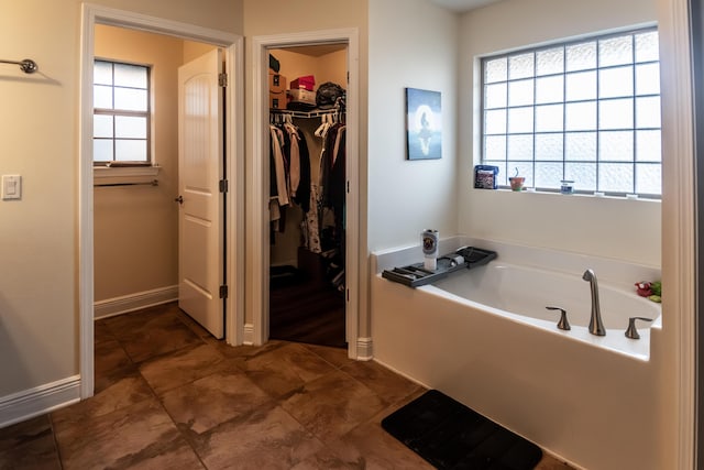 bathroom featuring a washtub