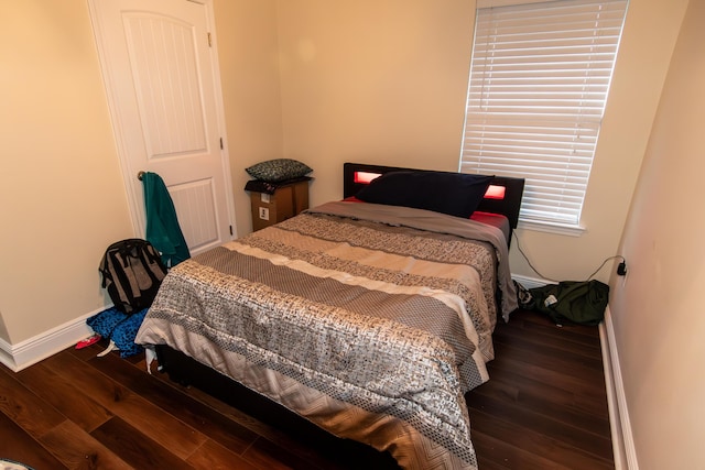 bedroom featuring dark wood-type flooring