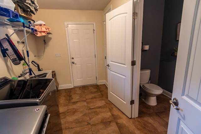 laundry room with separate washer and dryer