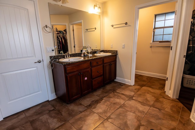 bathroom with vanity and tile patterned floors