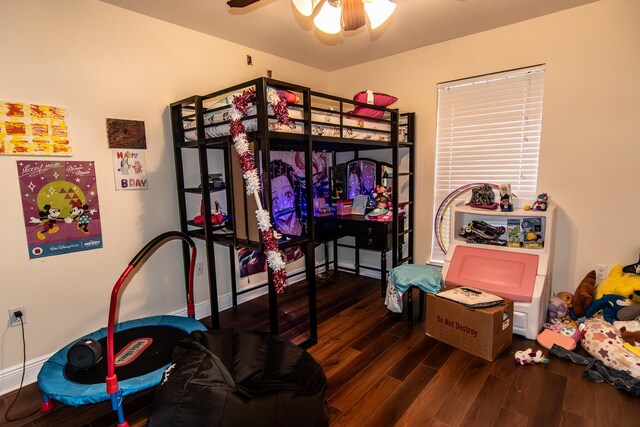 bedroom featuring dark hardwood / wood-style flooring and ceiling fan