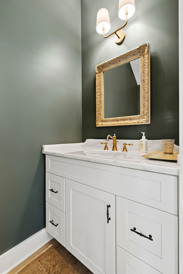 bathroom with hardwood / wood-style floors and vanity