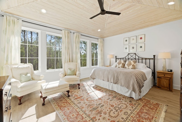 bedroom with ceiling fan, wooden ceiling, lofted ceiling, and light hardwood / wood-style floors