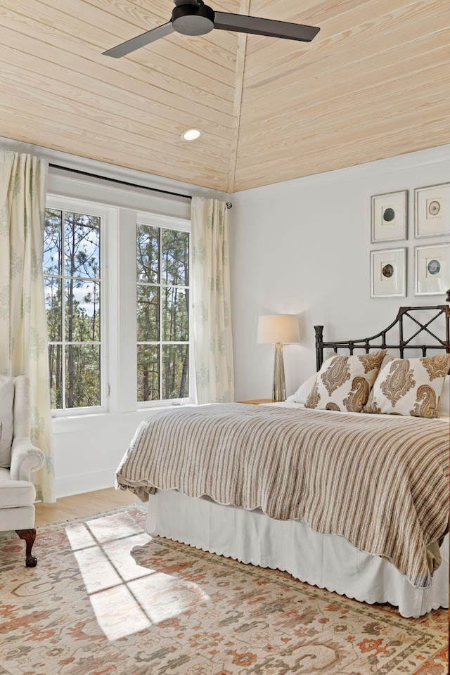 bedroom featuring vaulted ceiling, ceiling fan, and wood ceiling