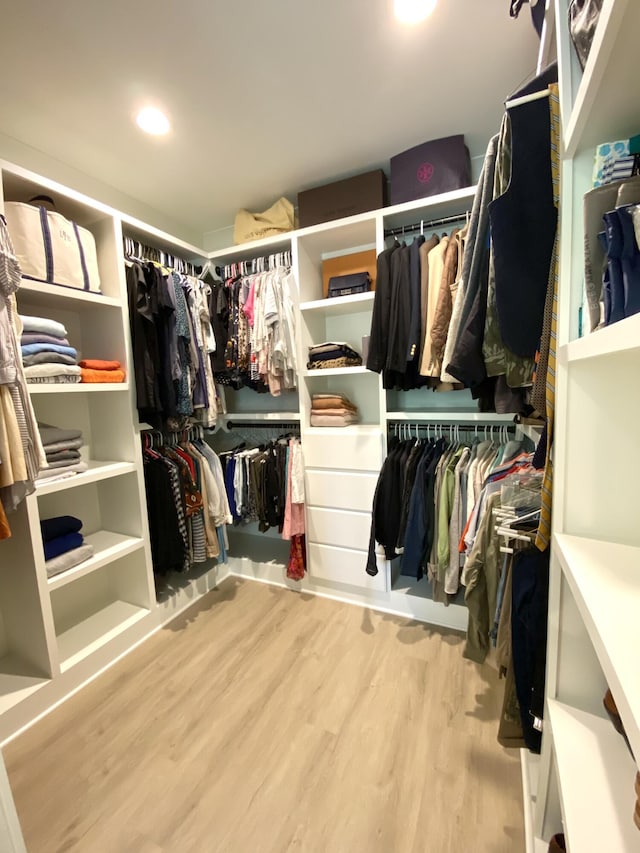 spacious closet featuring hardwood / wood-style floors