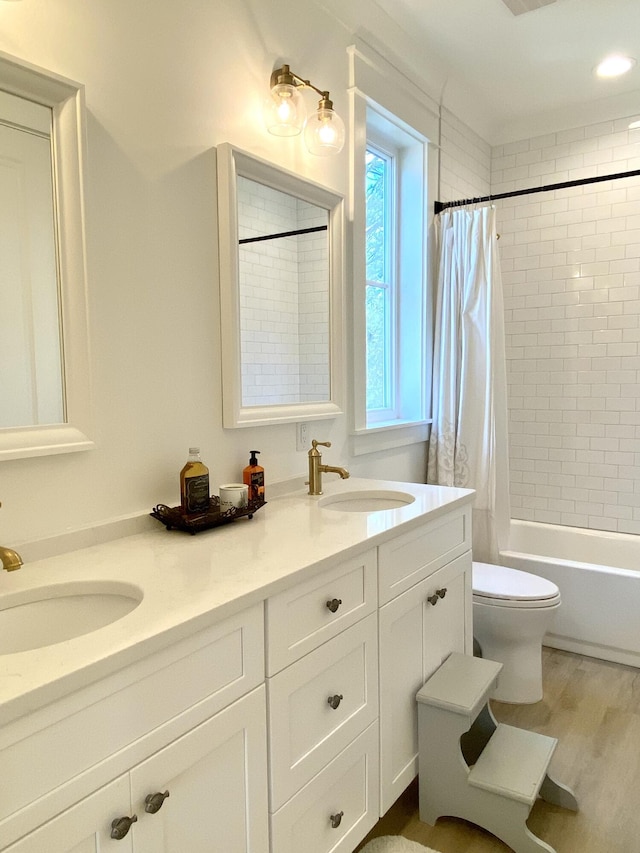 full bathroom featuring toilet, vanity, shower / bath combo, and hardwood / wood-style flooring