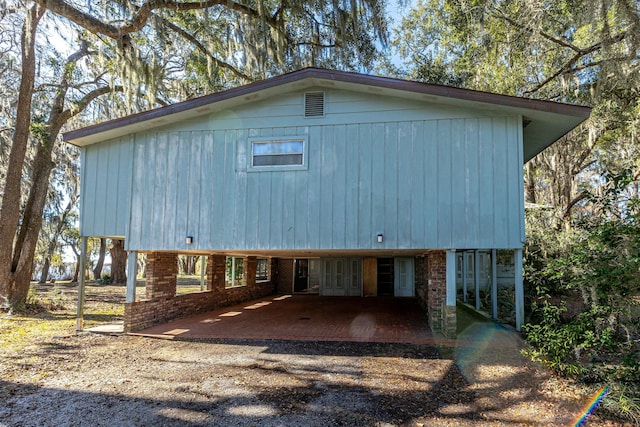 back of house with a patio