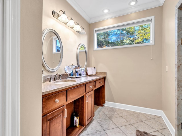 bathroom featuring tile patterned flooring, vanity, and crown molding