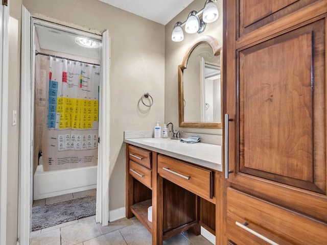 bathroom with shower / bath combo, vanity, and tile patterned floors