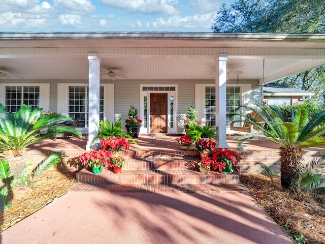 doorway to property featuring ceiling fan