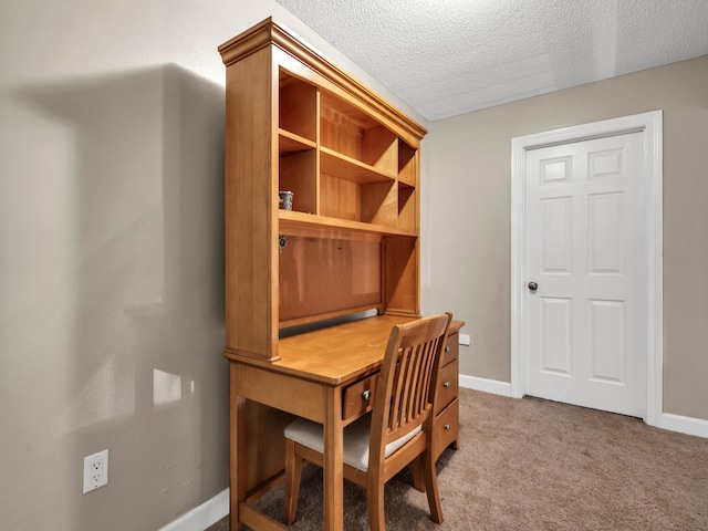 office with a textured ceiling and light colored carpet