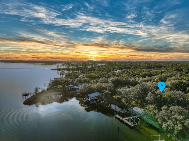 aerial view at dusk with a water view