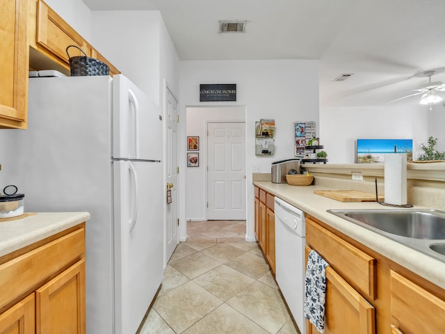 kitchen featuring ceiling fan, light tile patterned flooring, white appliances, and sink