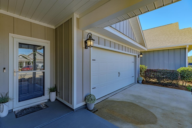 view of exterior entry with a garage