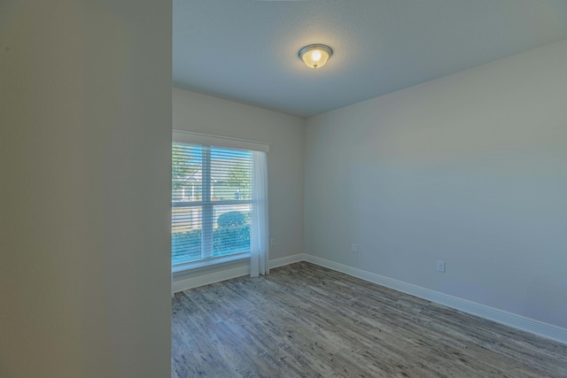 unfurnished room with light hardwood / wood-style flooring