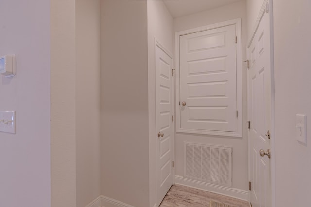 hallway featuring light wood-type flooring