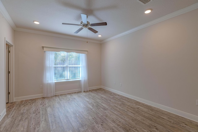 spare room with ceiling fan, light hardwood / wood-style flooring, ornamental molding, and a textured ceiling