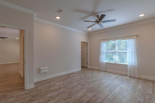 unfurnished room featuring ornamental molding, a textured ceiling, ceiling fan, and light hardwood / wood-style flooring