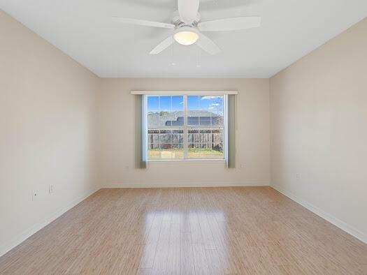 unfurnished room with ceiling fan and light hardwood / wood-style flooring