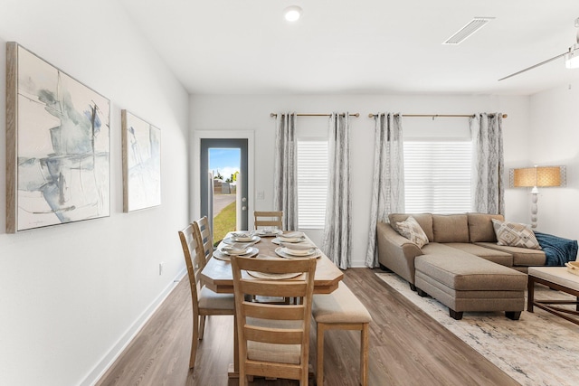 dining space featuring hardwood / wood-style flooring and plenty of natural light