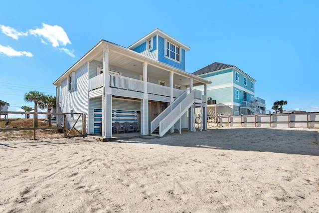 7646 Gulf Blvd, Navarre, FL 32566 - rear view of property featuring stairs and a porch
