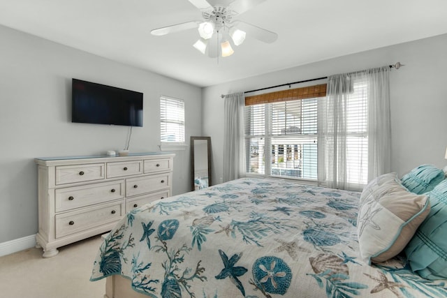 7646 Gulf Blvd, Navarre, FL 32566 - bedroom with light carpet and a ceiling fan